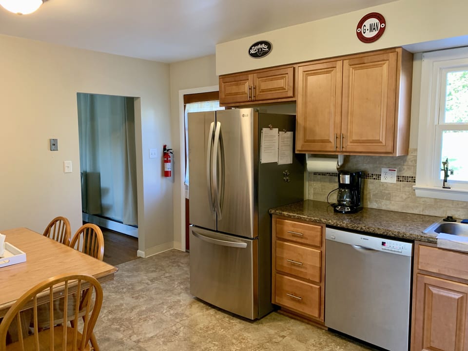 Kitchen includes brand new refrigerator with ice maker