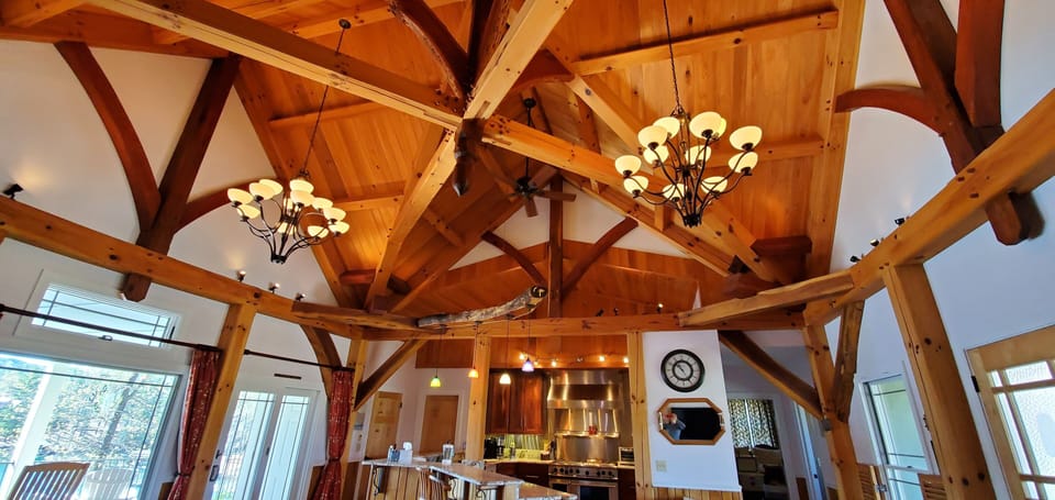 Upper level with custom craftsmen timber ceiling.