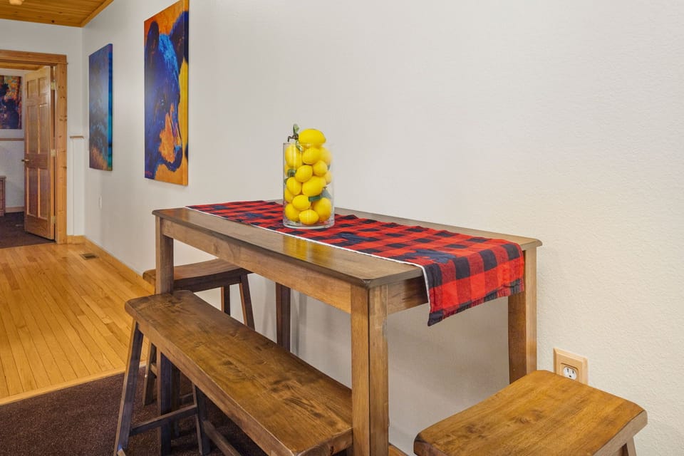 Gather around this cozy wooden dining table with bench seating—perfect for your morning coffee or evening card games with loved ones.