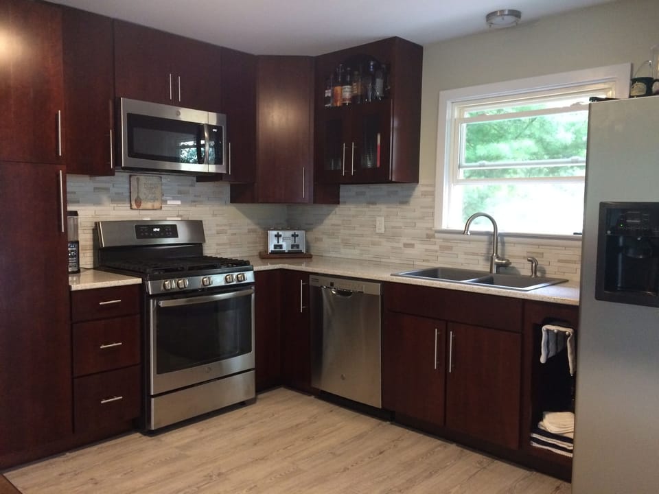 Cherry kitchen with stainless appliances
