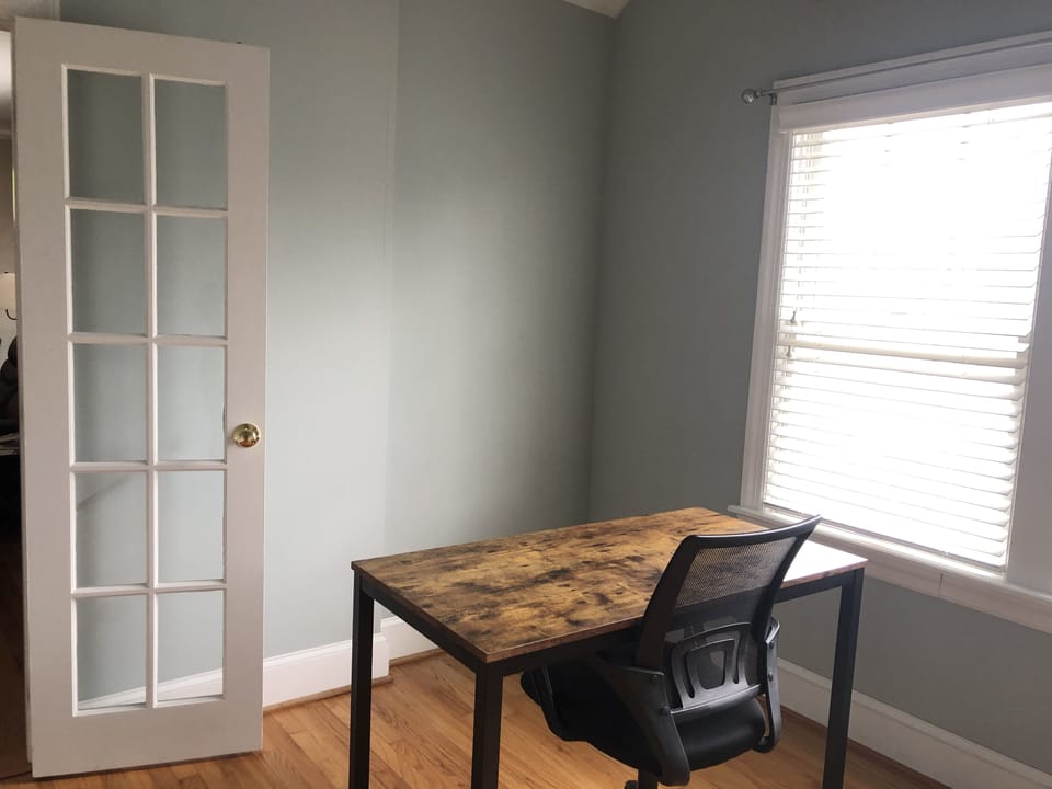 Separate office with large windows and glass doors. 