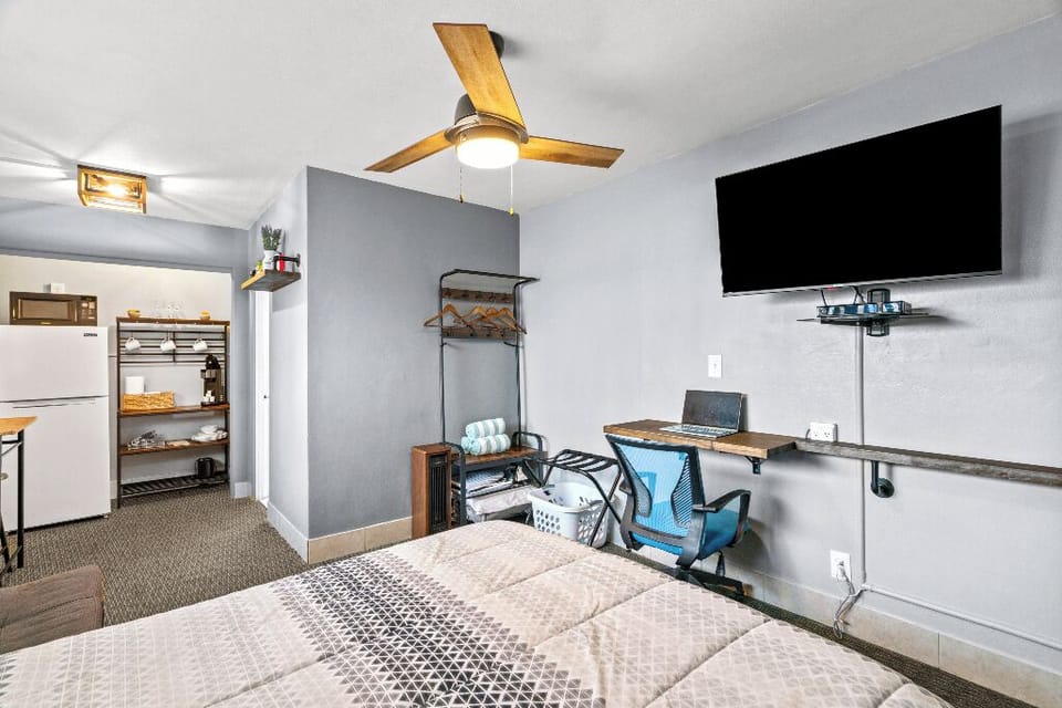 Boutique Beach Retreat open concept kitchenette, refrigerator/freezer, coffee bar, with kitchen basics, and seating area work station