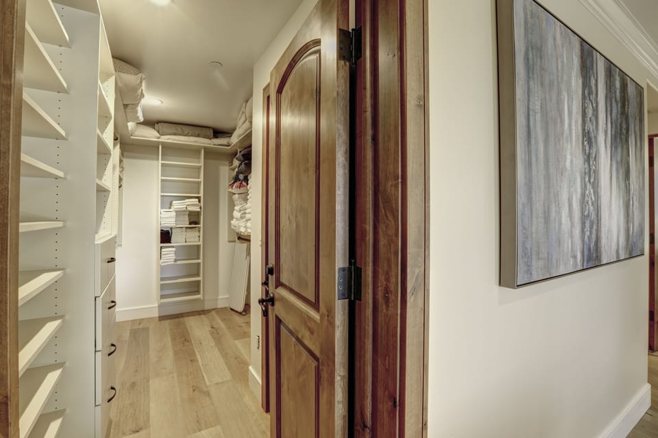 Walk in closet for your vacation wardrobe storage.