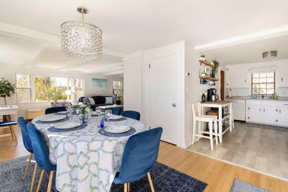 Dining table is central to kitchen and living room. Table seats 8.