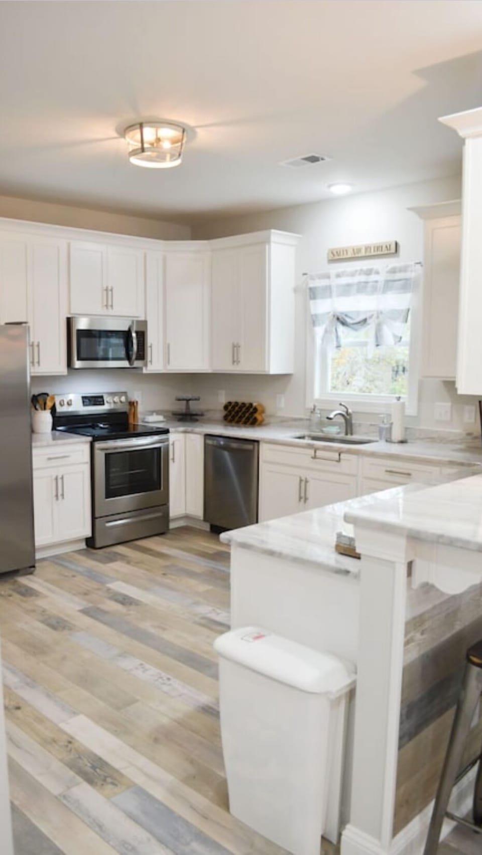 The kitchen has granite countertops and stainless steel appliances!