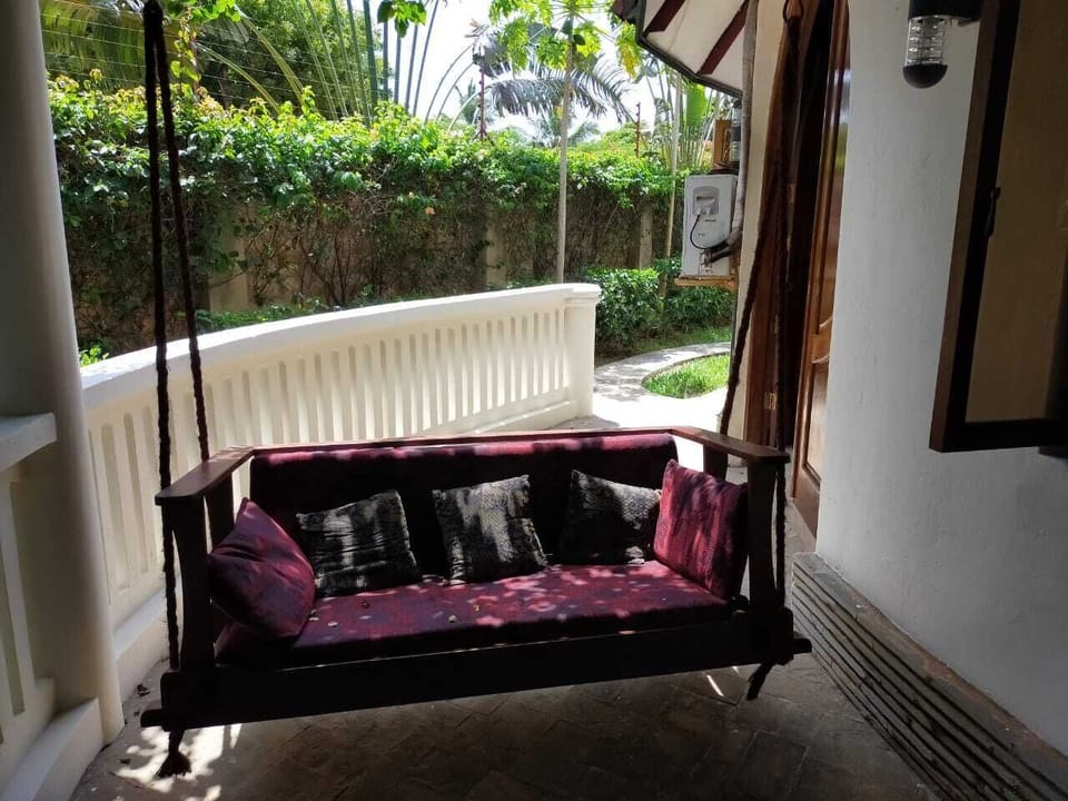 Pagoda (or verandah), outside the living room. Swingchair..for sheer relaxation.