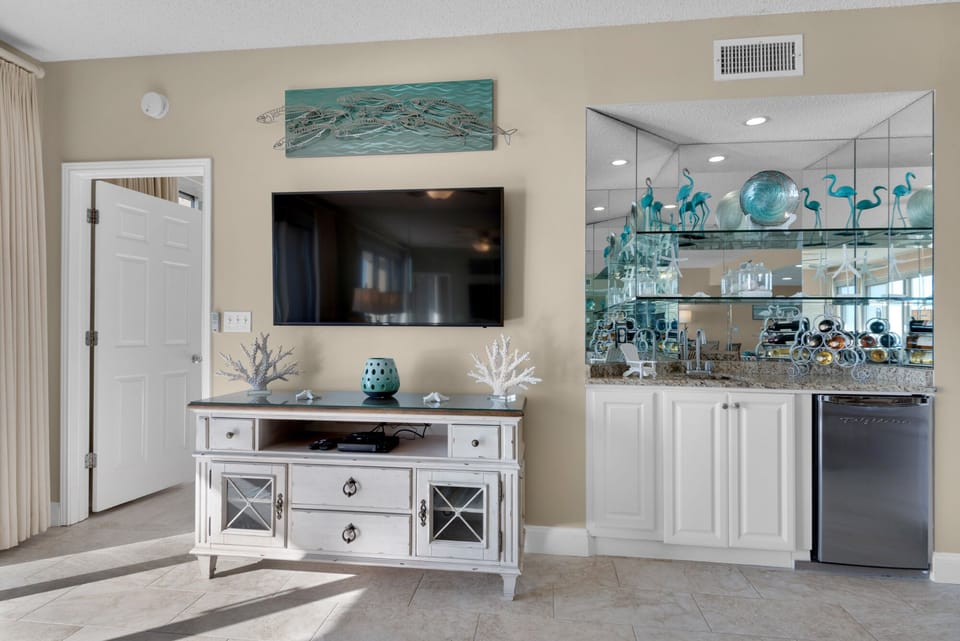 Wet bar features a refrigerator to store all your happy hour items.
