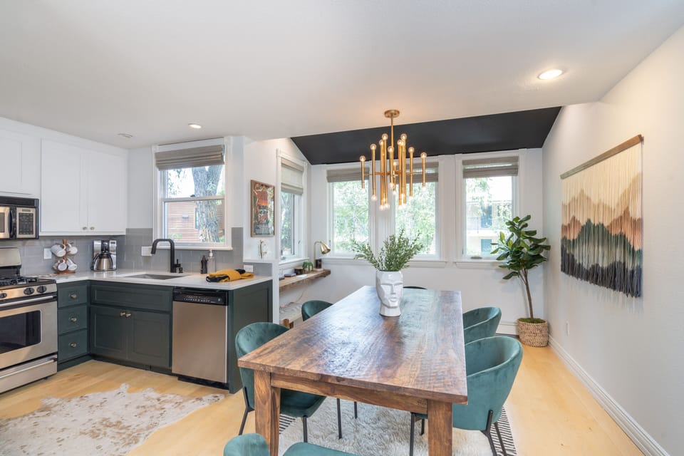 View of kitchen over dining room table.