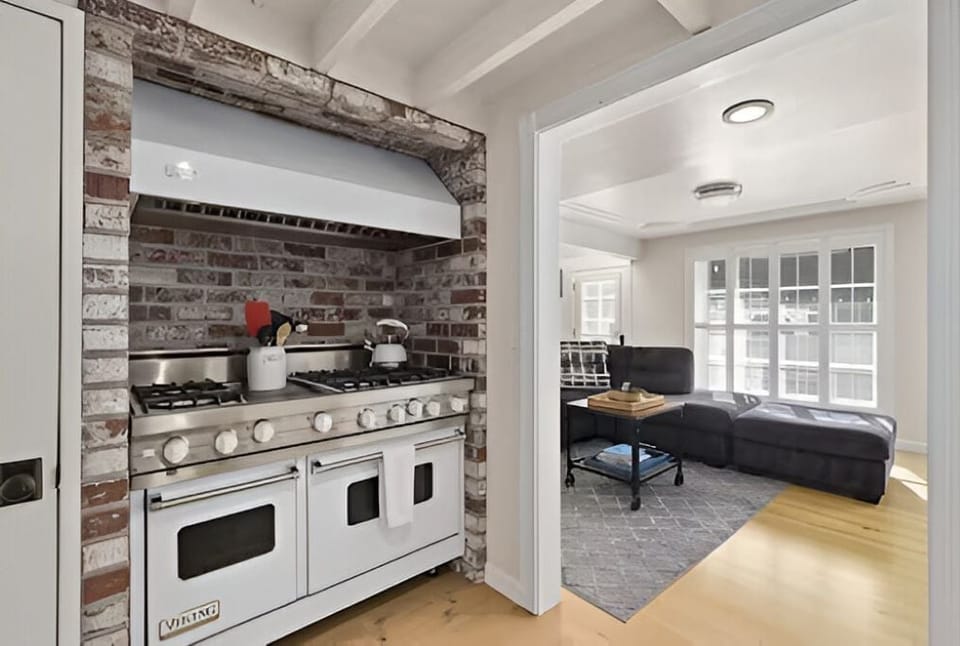 Viking range nestled in brick nook