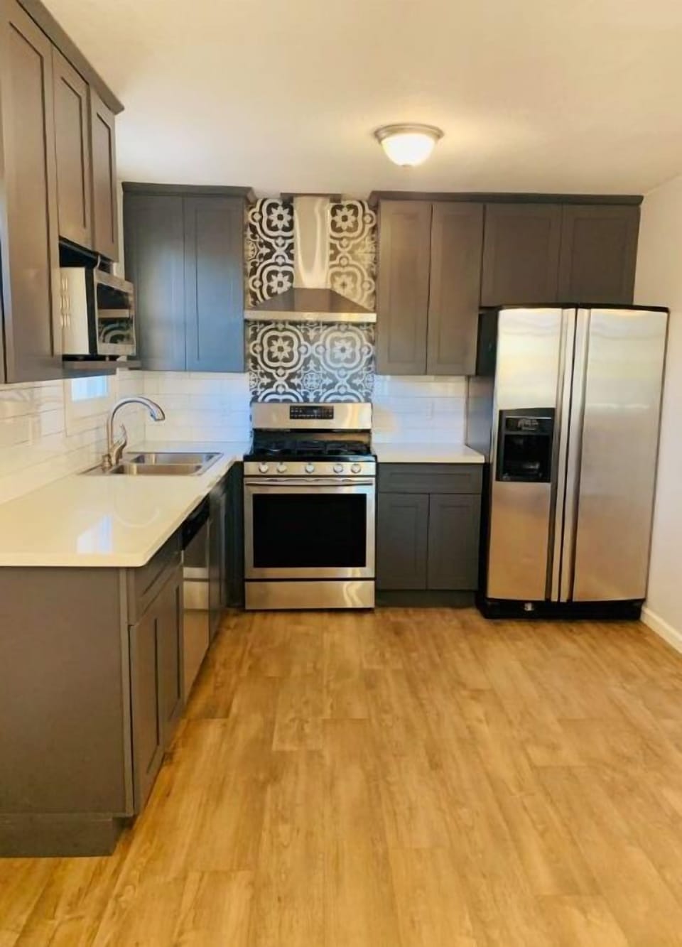 Beautiful kitchen with stainless steel appliances. 