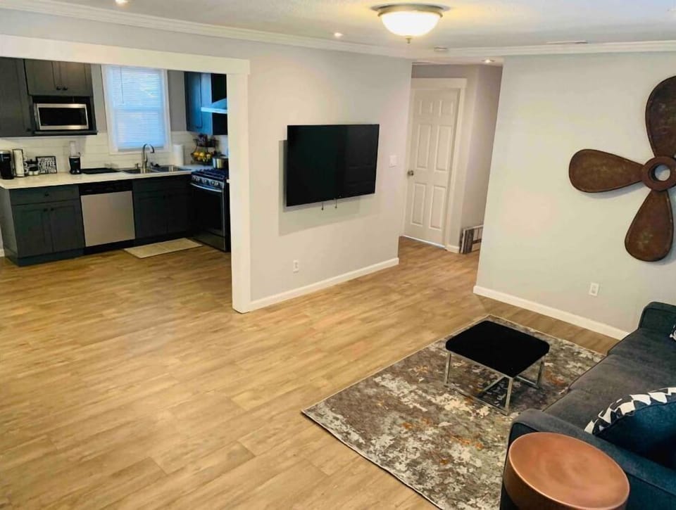 Open concept living room area with smart tv 