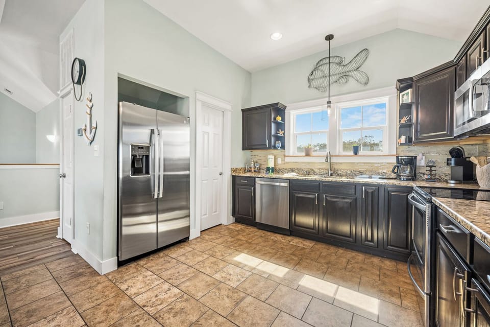 Kitchen with Bar Seating on Fourth Level