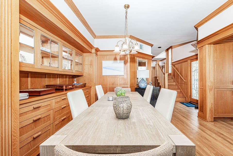 Dining room opens to the living room, kitchen, and bedrooms beyond.
                