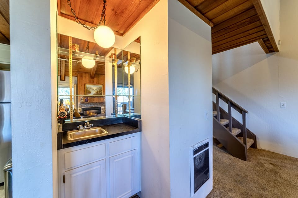 Small wet bar off the kitchen and living area.