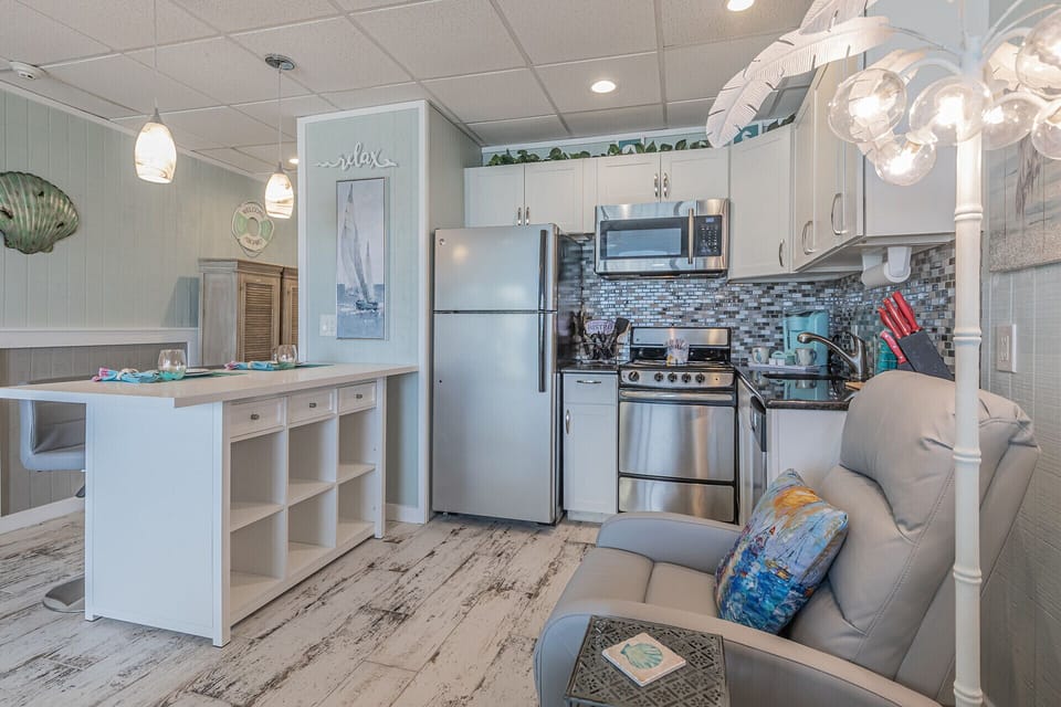 Open kitchen equipped with the essentials of home including a dishwasher 