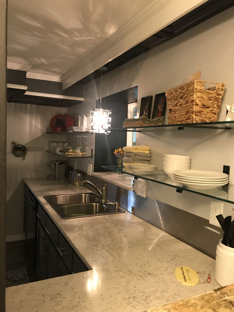 Quartz countertops, crystal champagne flutes and chandelier- just like home