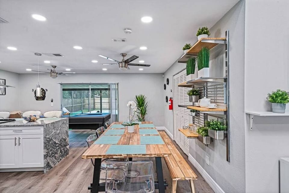 Open view of our beautiful dining area, fully equipped kitchen and play area that has ping-pong table. Never run out of activities while staying at our stunning property! Send us an inquiry as soon as possible!