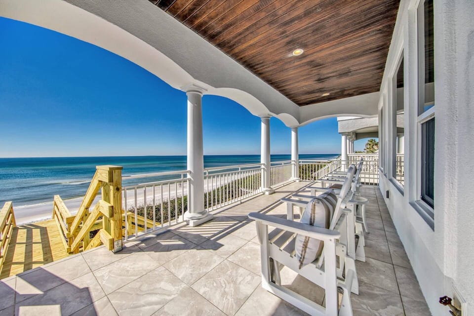 This beautiful beach home is located directly on the gorgeous white sands of the Emerald coast