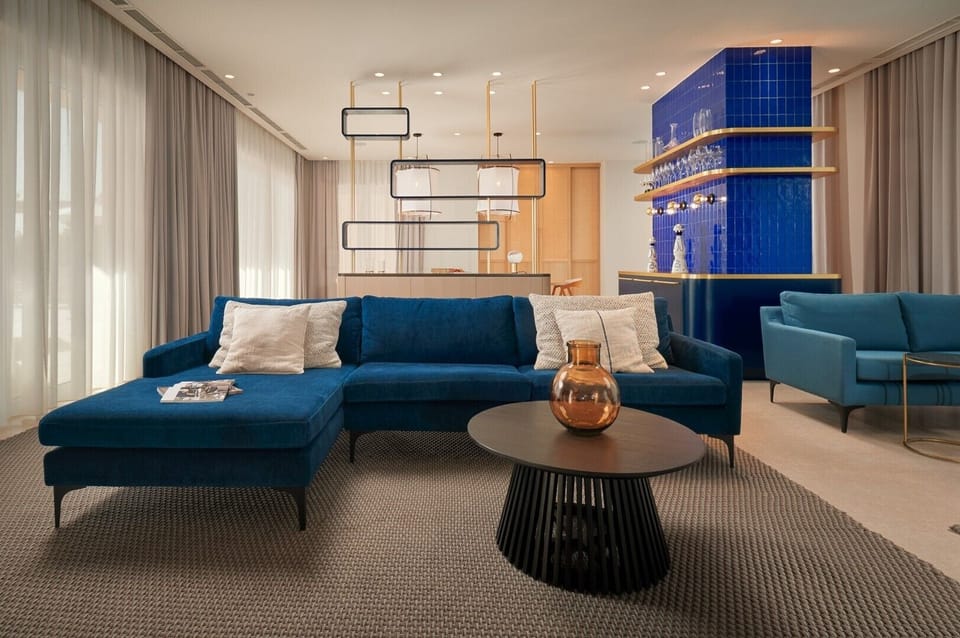 Living room area of Croatia luxury pool with sofas and coffee table for vacation and rent with friends