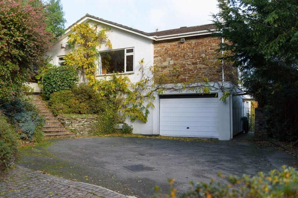 Front of house with parking for 4 cars
