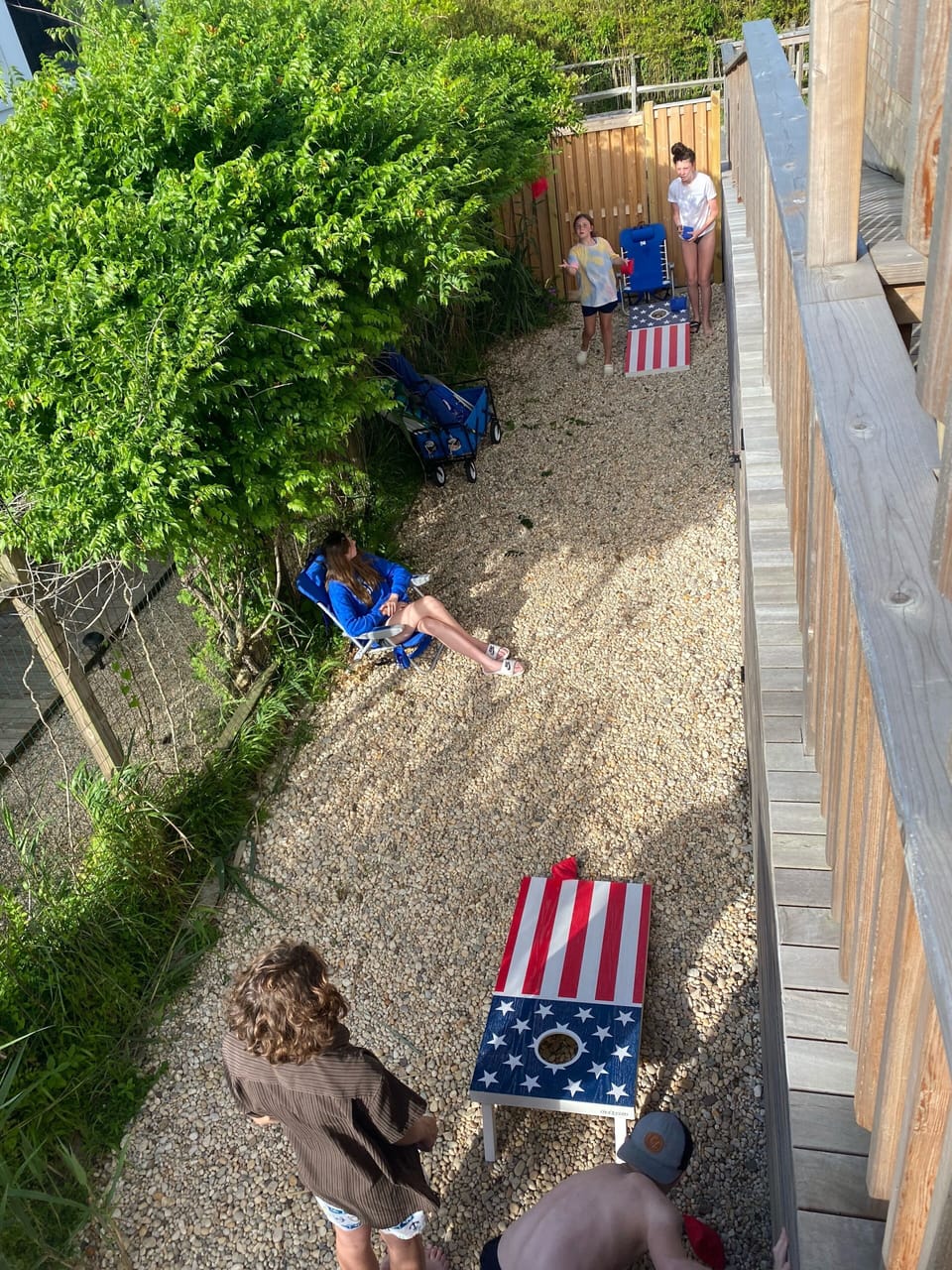Side yard with corn hole set