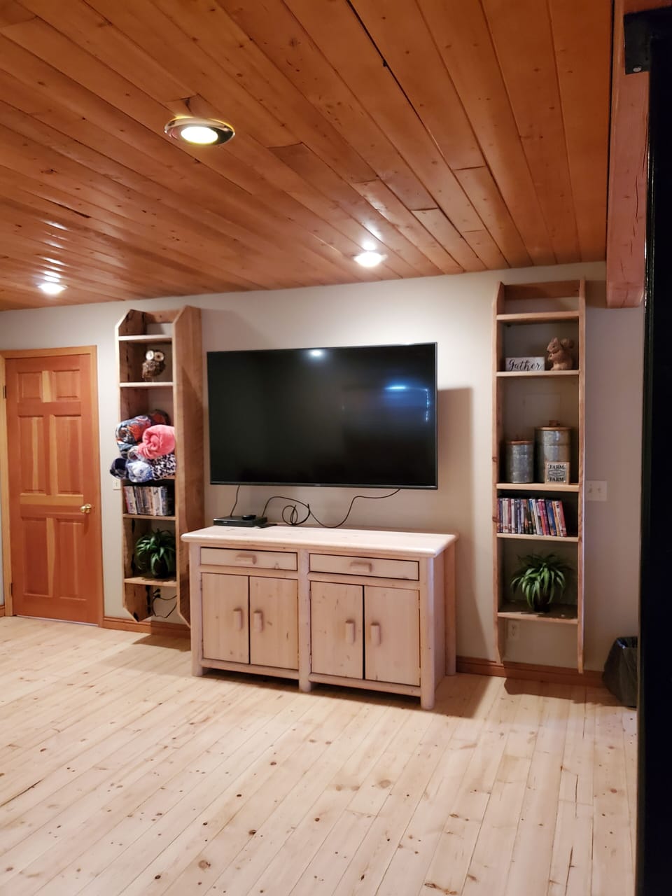 Basement common area with large screen smart TV