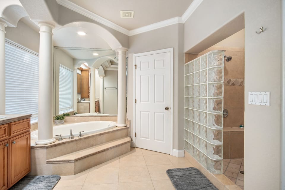 Full bathroom 1 - with hot tub, shower, and toilet