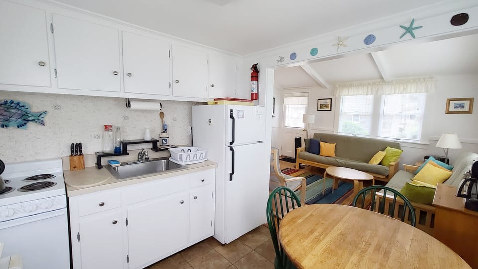 Well equipped kitchen opens to living room