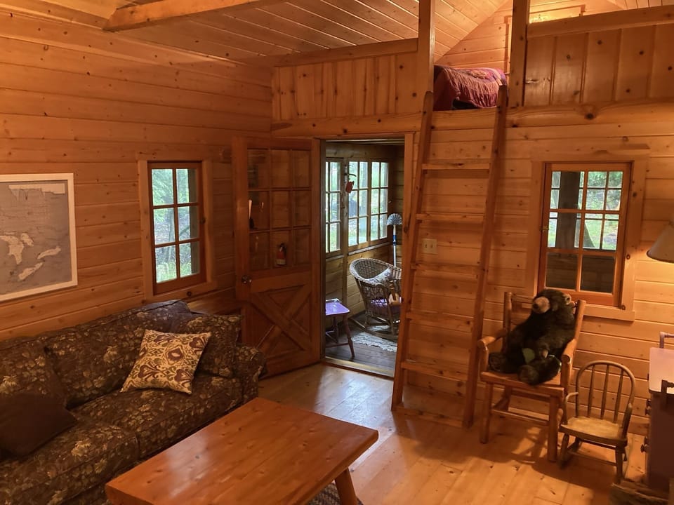 Hide-a-Way cabin: view up to the sleeping loft or out to the sunroom. 