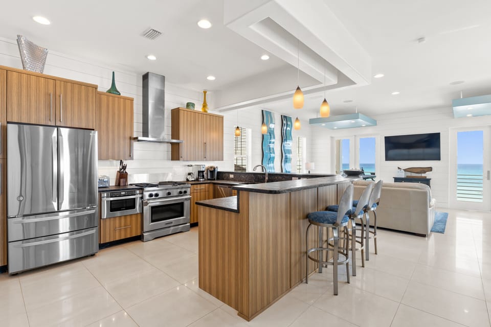 Spacious full kitchen with gas oven, dishwasher, and modern appliances for effortless cooking.