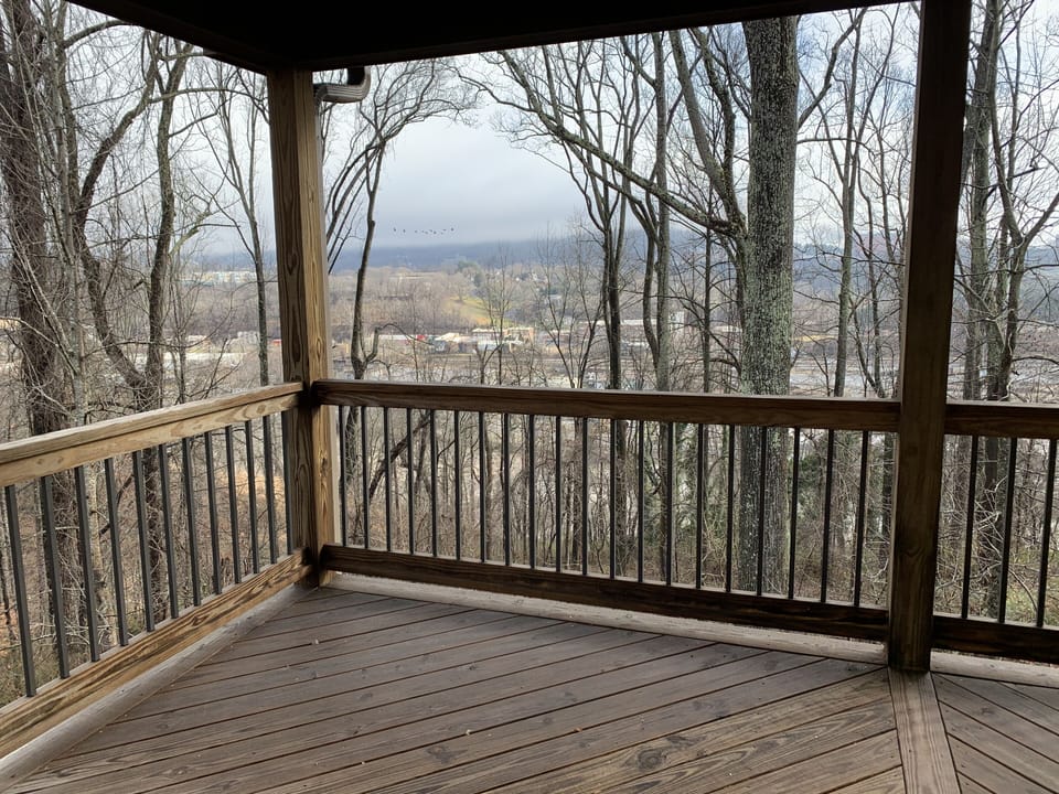 Main Level covered deck has views of the River Arts District and Downtown beyond