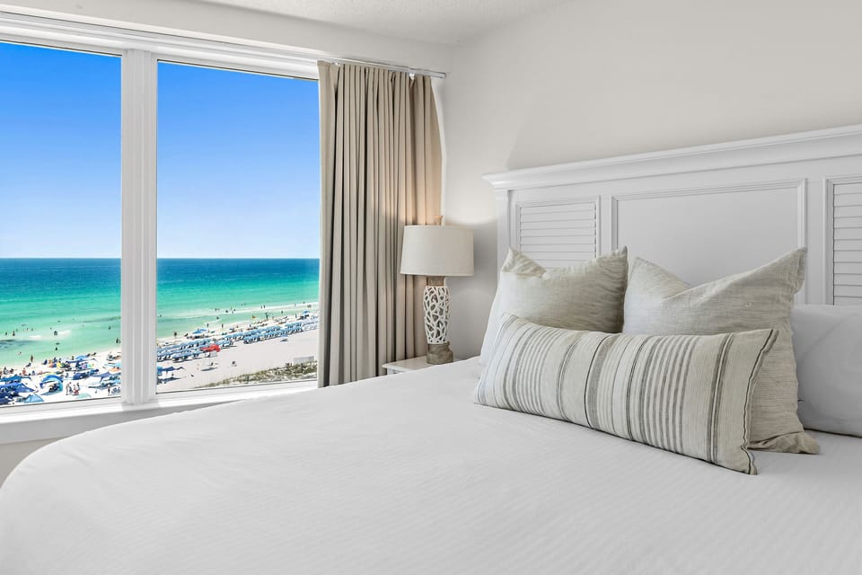 Enjoy beachfront views right from the comfort of your bed