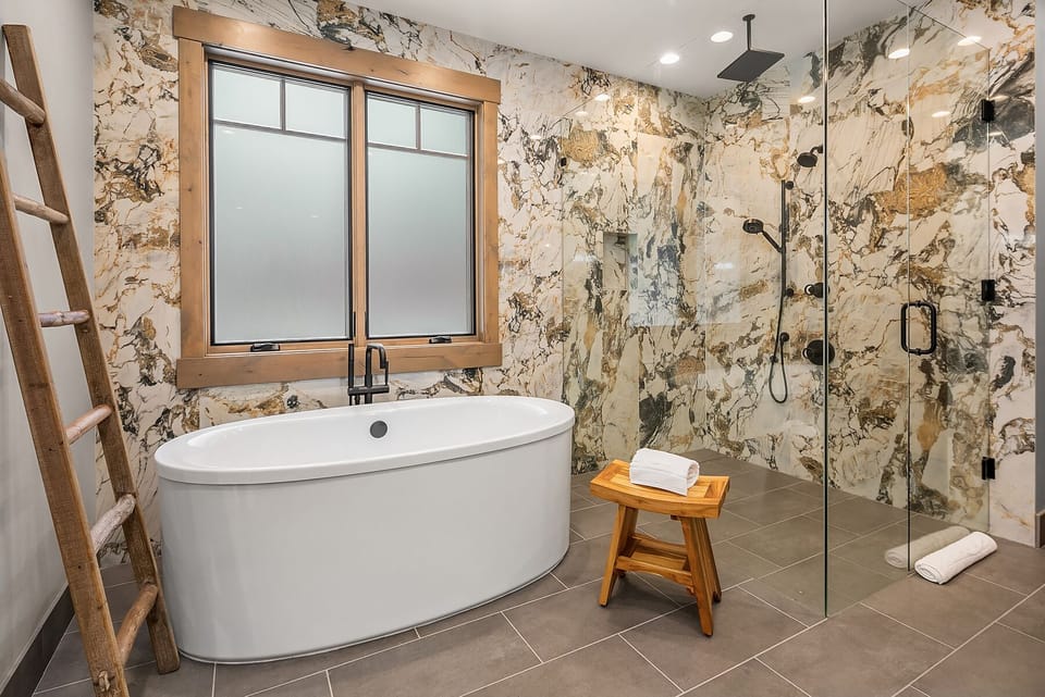 Dreamers Lodge: - Master bath with a soaking tub, and a huge glass walled rain shower.
