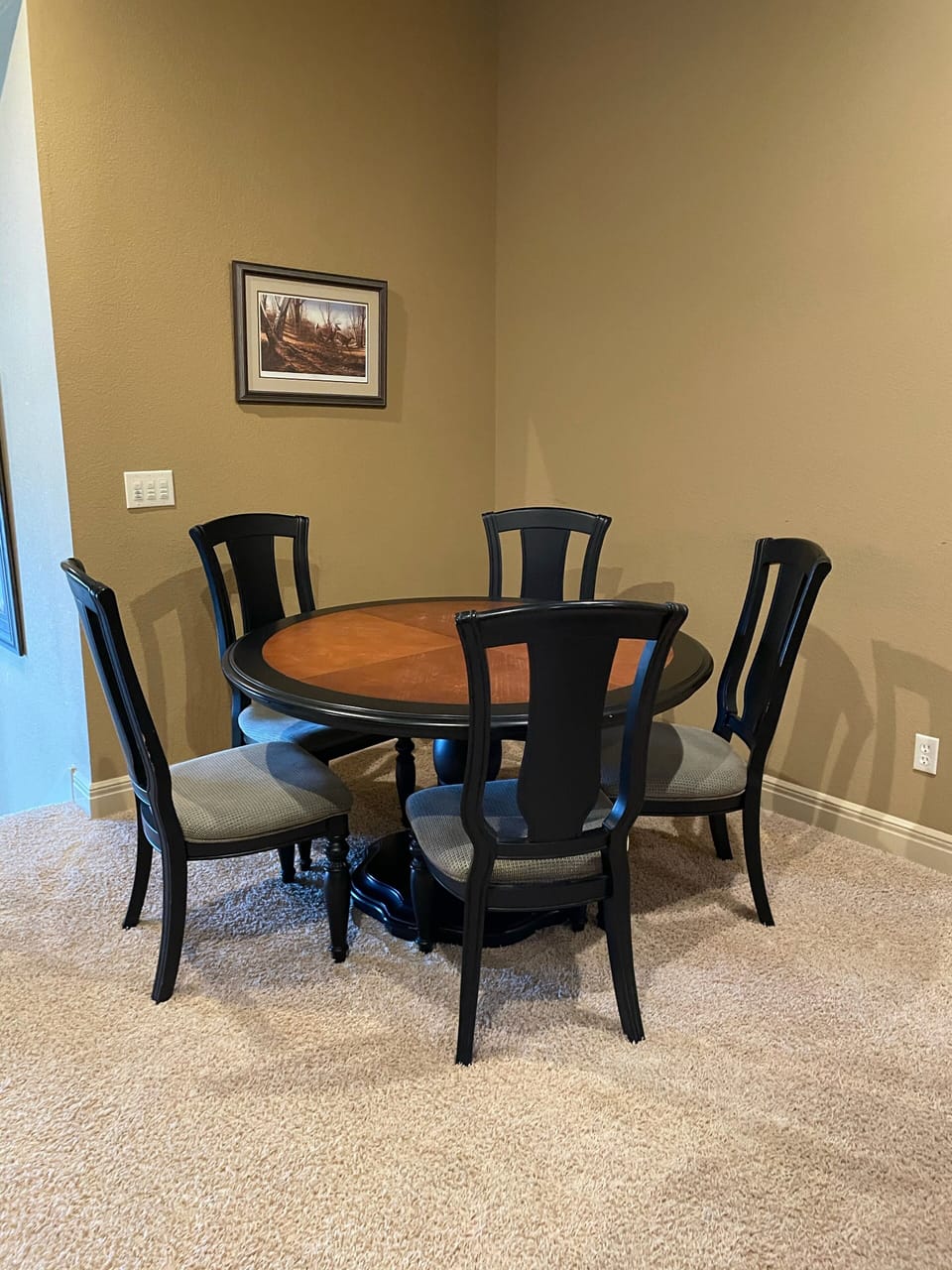 Mid level game room and bar with table and chairs seating for 5 & 4 bar stools