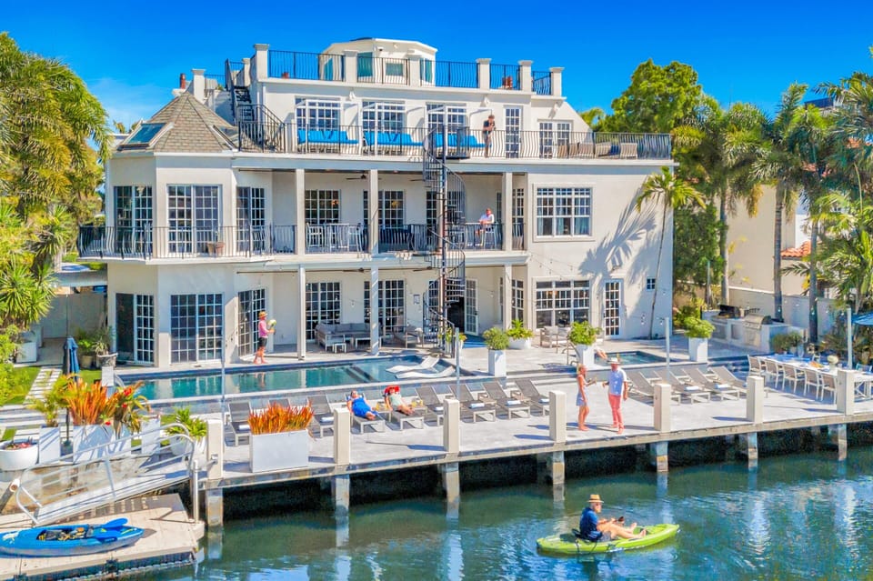 100 feet dock with loungers, dinning table, canal views, heated pool, hot tub, terraces, rooftop with a bbq - ideal villa for entertaining.