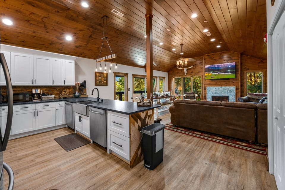 Indulge in culinary delights with a view that takes your breath away! Our fully stocked gourmet kitchen offers the perfect backdrop of majestic mountains. Cook, dine, and savor the flavors of the peaks.