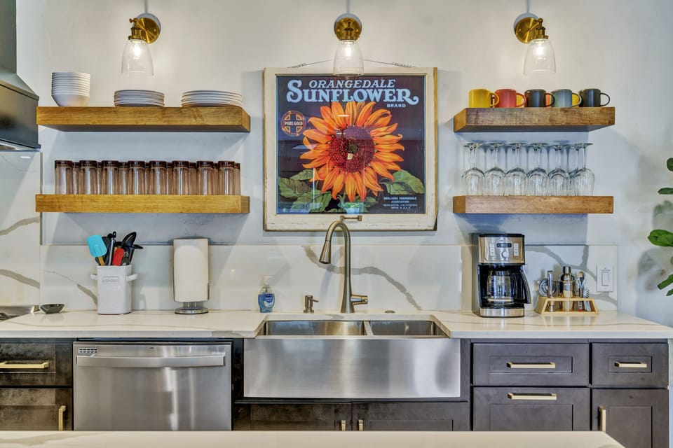 Stocked with dishes, cups and utensils.