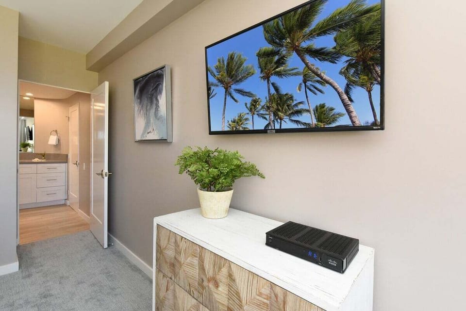 Enjoy entertainment and modern comforts in this stylish bedroom corner