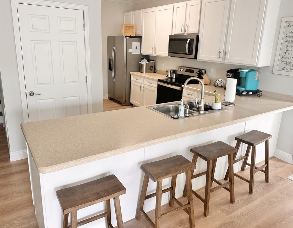 Kitchen has additional seating for 4