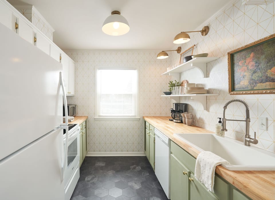 Adorable remodeled kitchen with modern functionality and vintage charm.