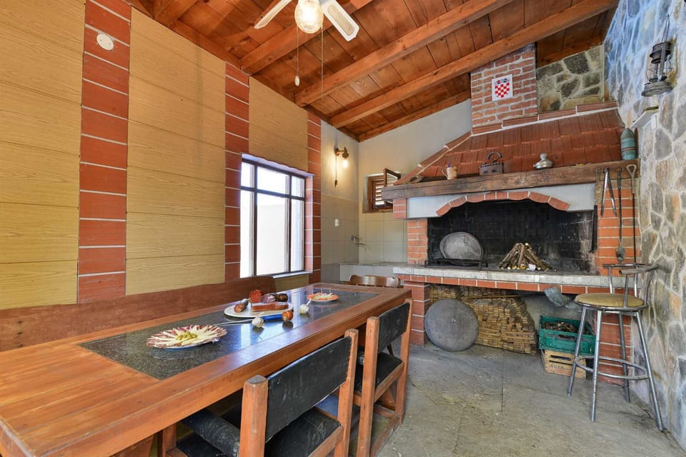 Traditional dalmatian tavern with open fireplace and dining area