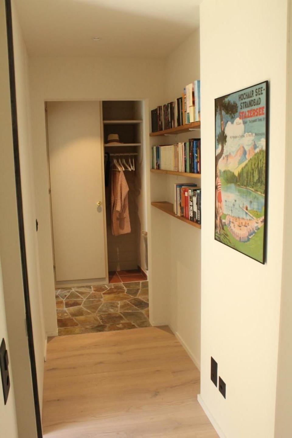 View through the corridor to the wardrobe with bookcase
