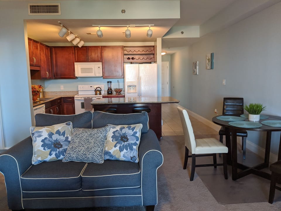 Living room is combined with kitchen. It has access to balcony.