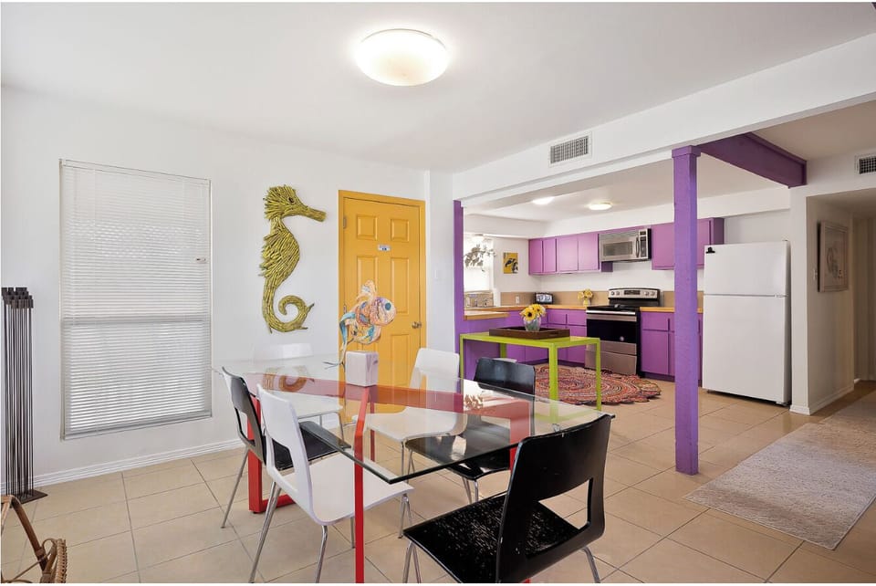 Open dining space with direct access to kitchen, ideal for shared meals and prep