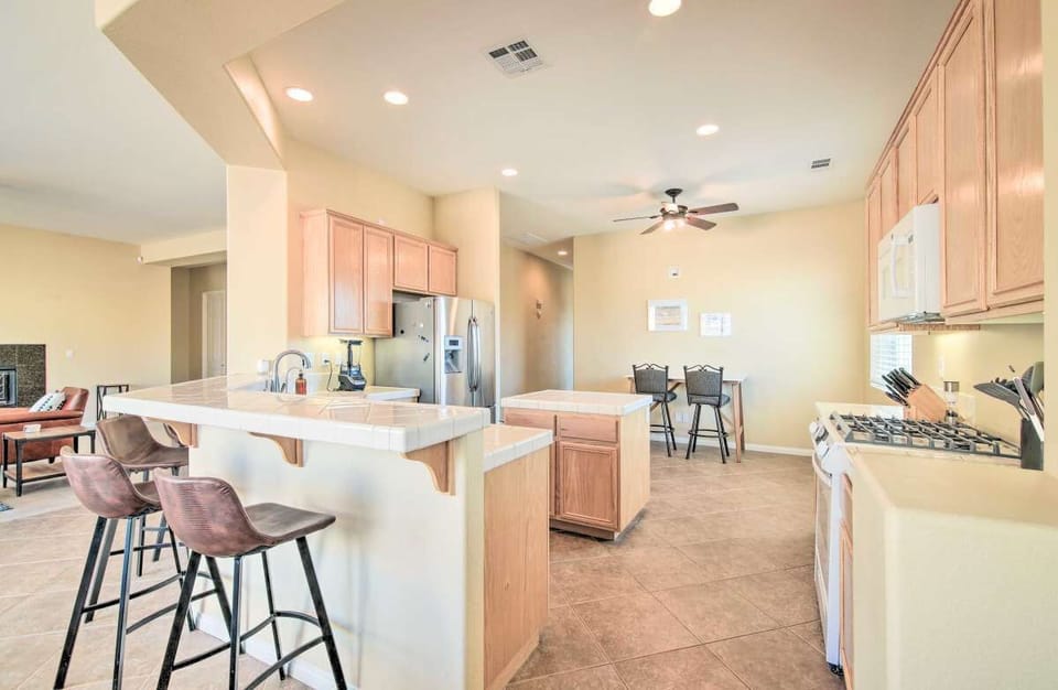 Kitchen, breakfast bar, and work-station desk in the nook. 