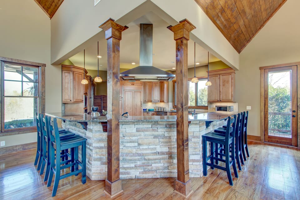 Chef's kitchen with island bar seating