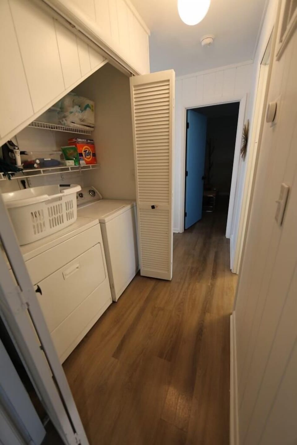 Laundry in hallway between downstairs rooms