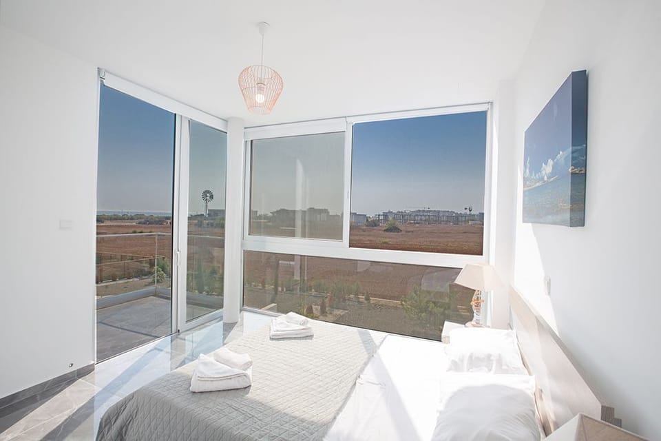 Master Bedroom with en suite bathroom, double bed and balcony