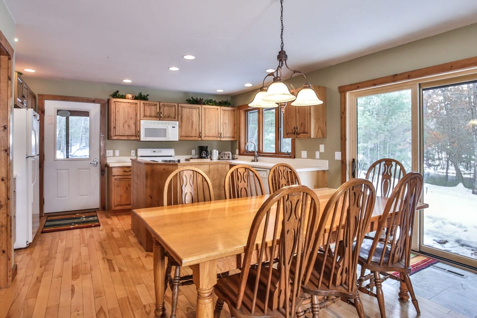 open concept kitchen and dining allows the cook to stay social