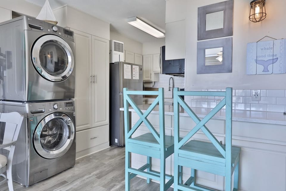 Bar seating, and the washer and dryer pictured.